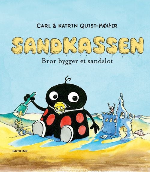 Sandkassen. Bror bygger et sandslot